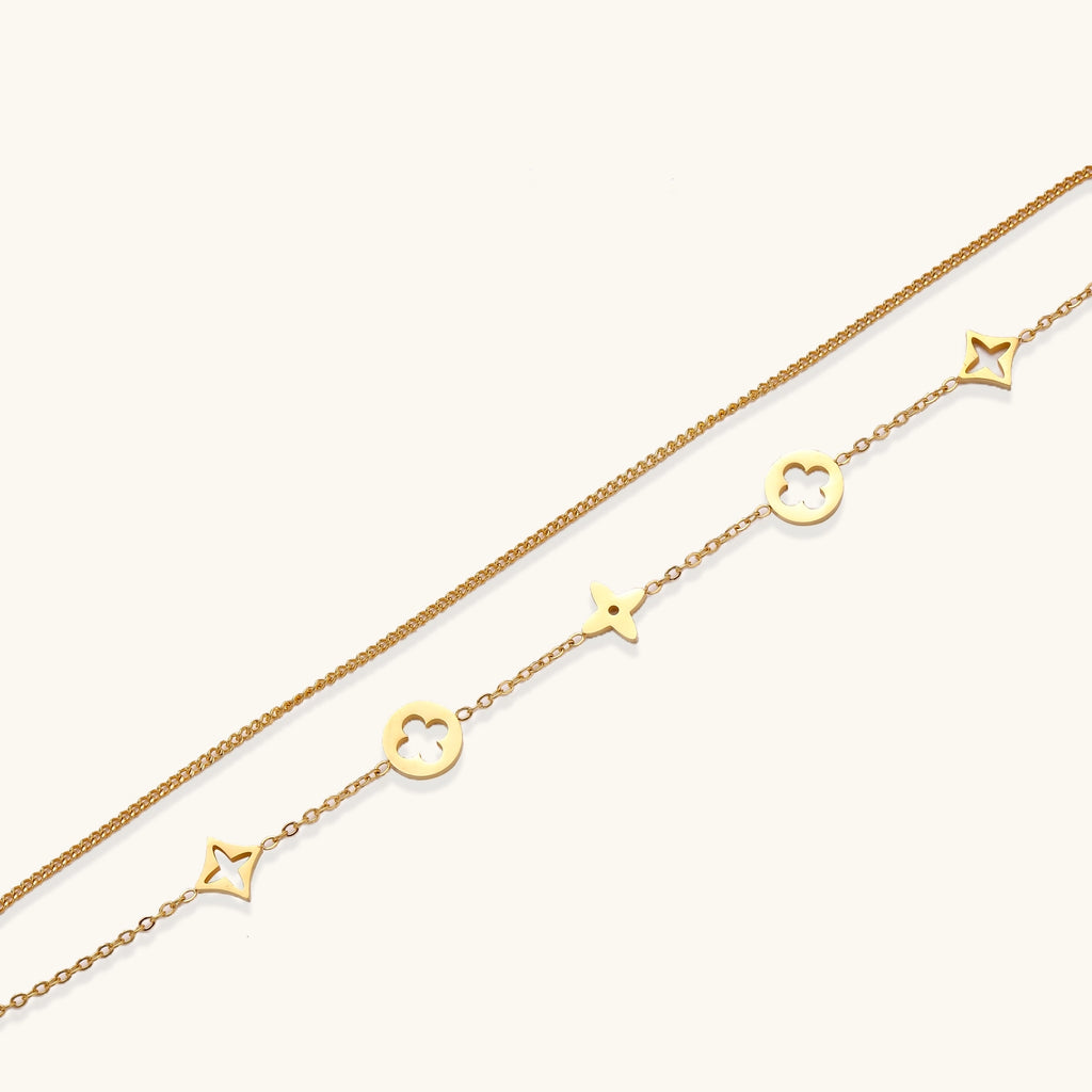 Dainty gold-plated bracelet with star and clover charms on double chain with adjustable extender