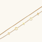 Dainty gold-plated bracelet with star and clover charms on double chain with adjustable extender